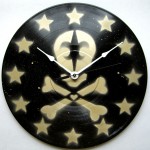 black and gold skull de lis clock
